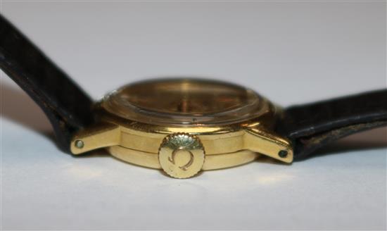 A ladys 1950s 18ct gold Omega manual wind wrist watch.